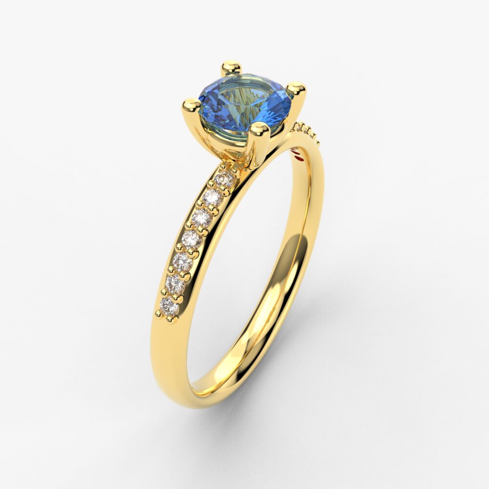 Prsten model 57 od žutog zlata sa plavim topazom i brilijantima