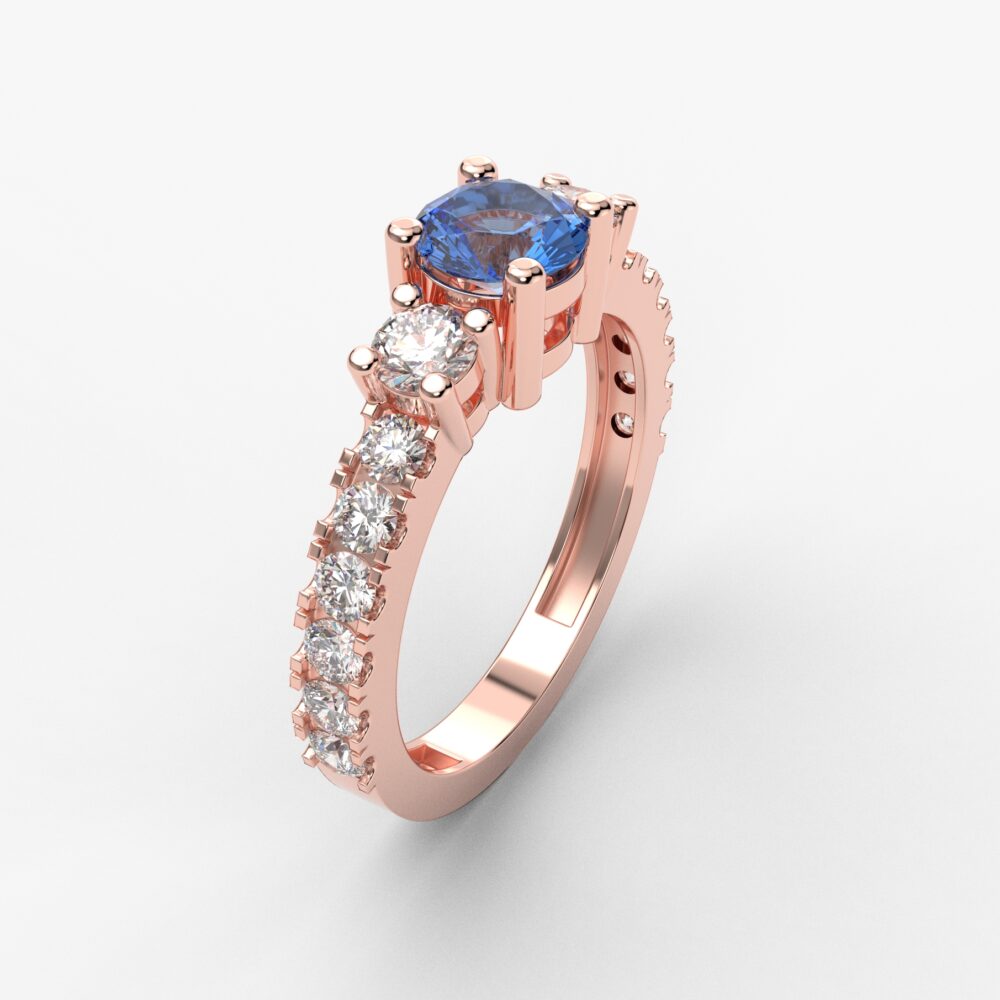 Prsten model 80 od roze zlata sa plavim topazom i cirkonima