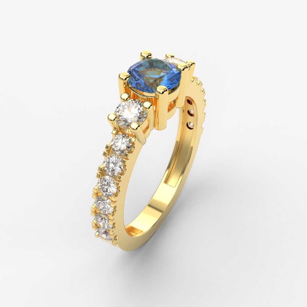 Prsten model 80 od žutog zlata sa plavim topazom i brilijantima