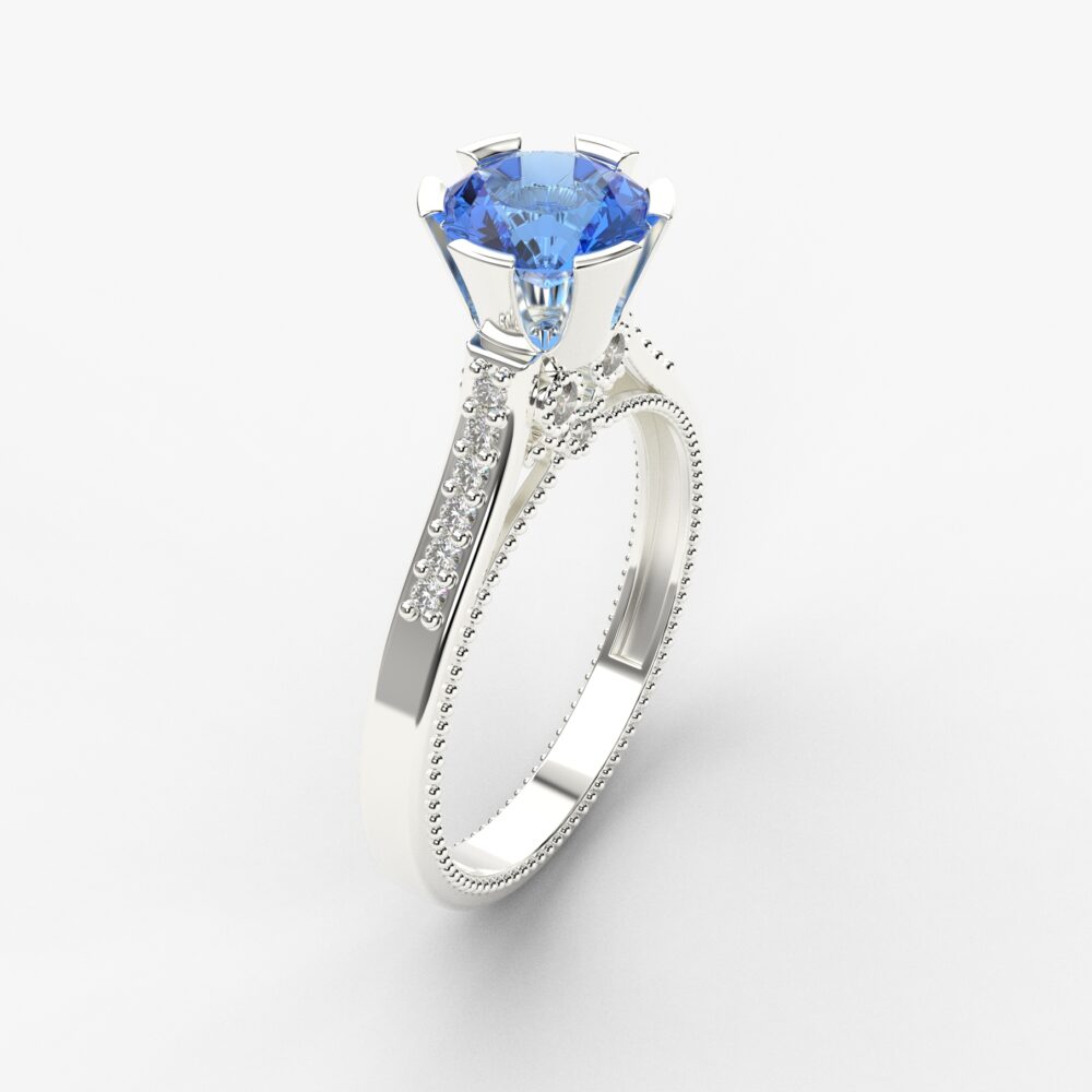 Prsten model 105 od belog zlata sa plavim topazom i brilijantima