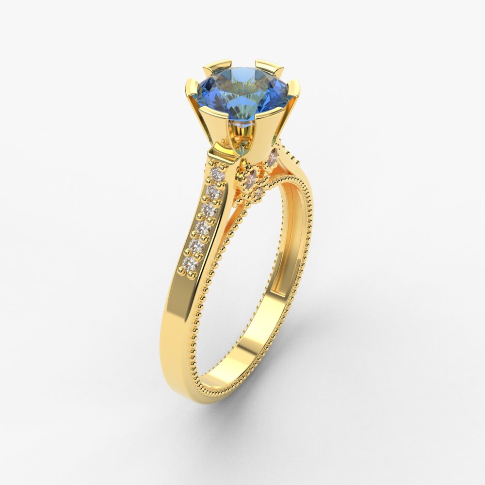 Prsten model 105 od žutog zlata sa plavim topazom i cirkonima